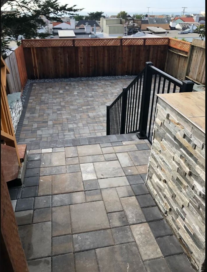 Backyard paver patio and retaining wall installation by Garescape