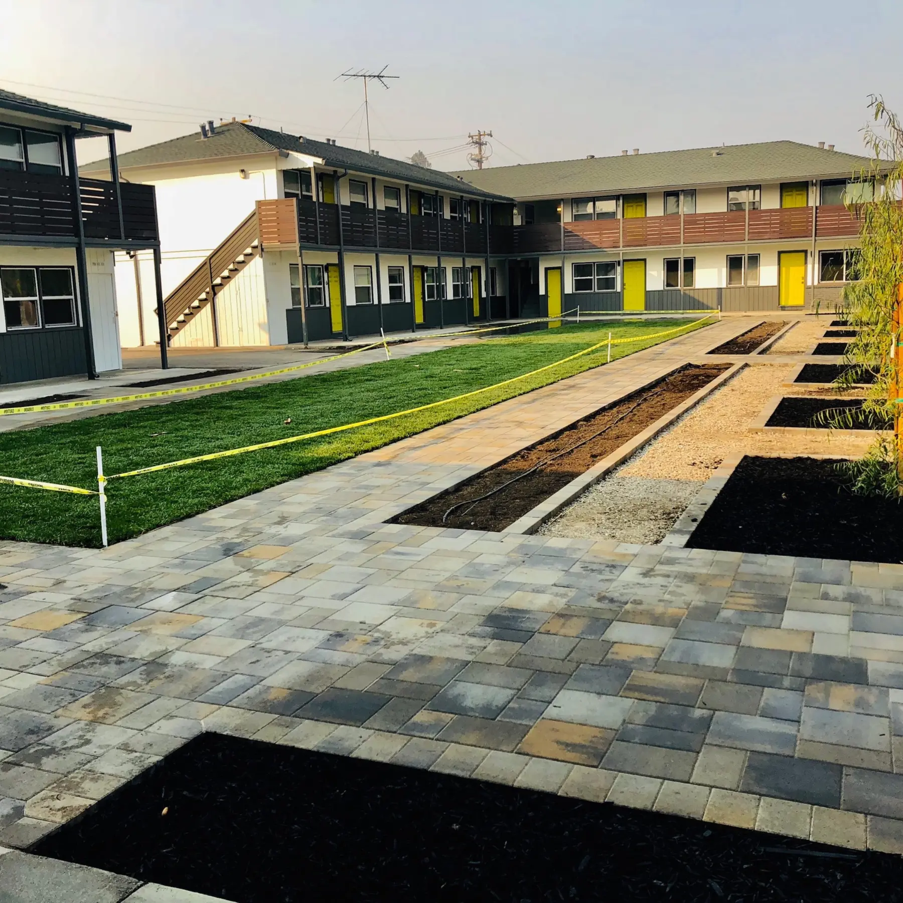 Landscape irrigation installation with visible drip lines by Garescape