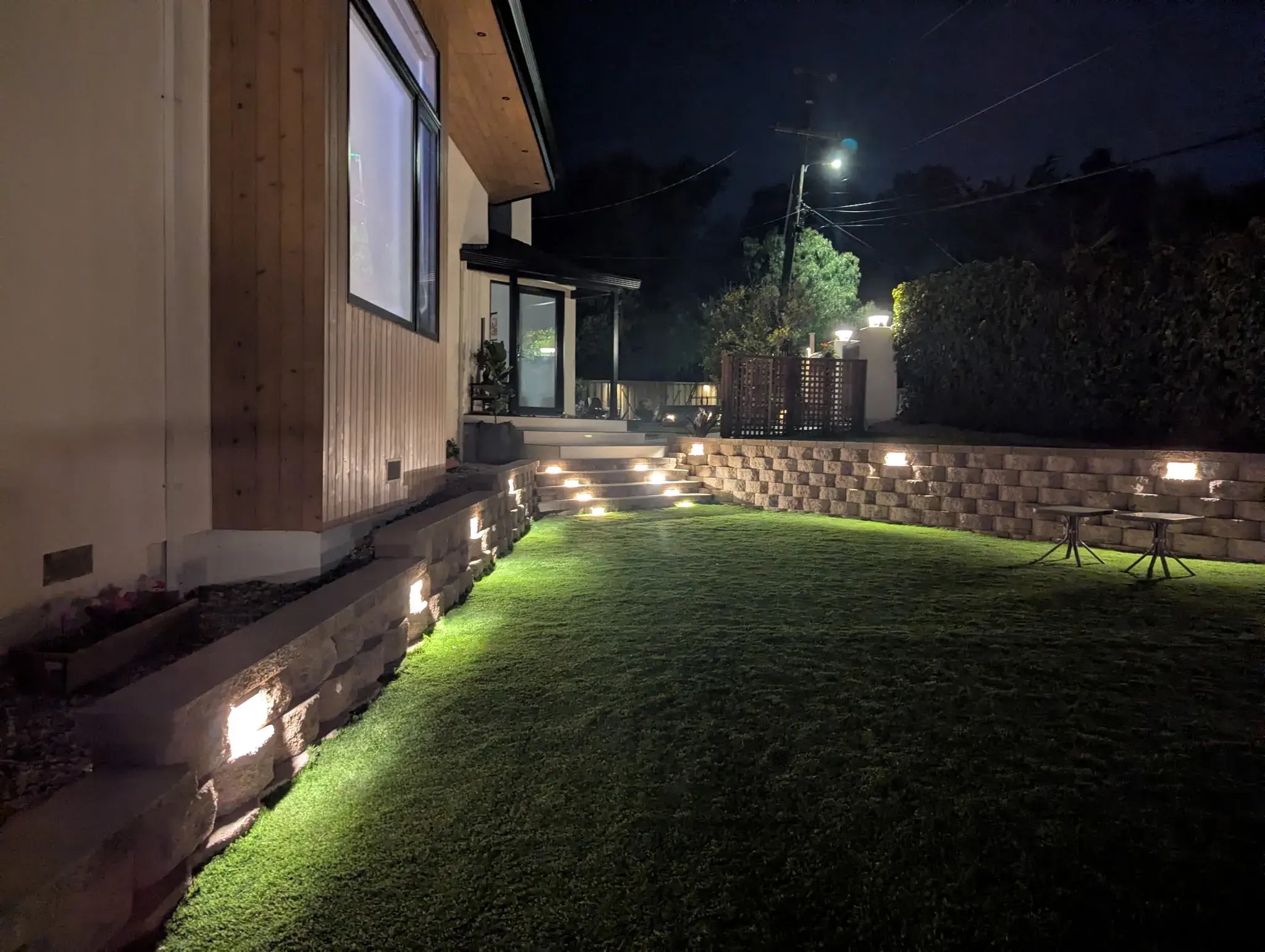 Low-voltage landscape lighting illuminating retaining walls and steps installed by Garescape in the Bay Area